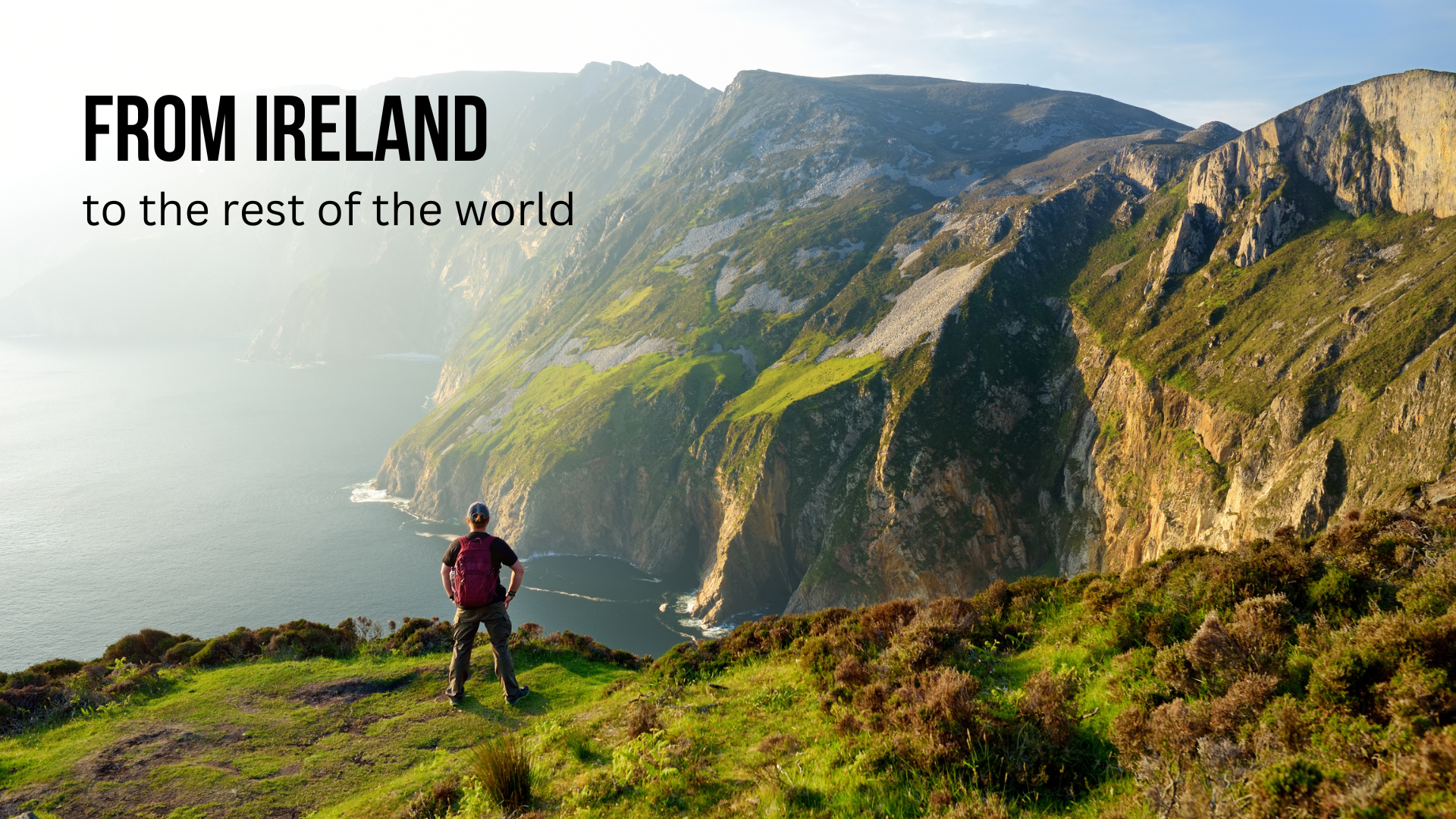 A man standing on a cliff edge looking at a view of sea and cliffs. Text overlain reads 'From Ireland to the rest of the world'